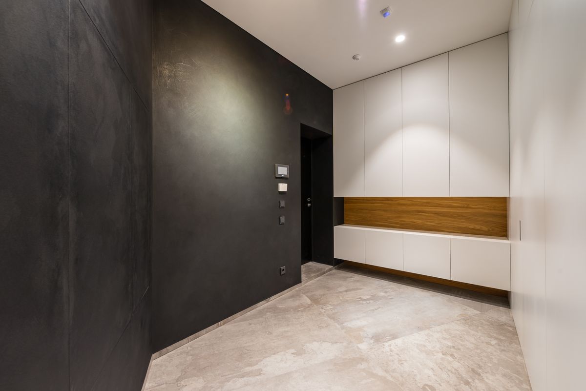 Modern room interior with a tiled floor under a lamp