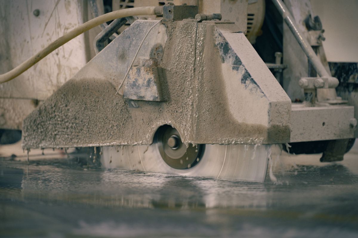 Concrete saw cutting a floor